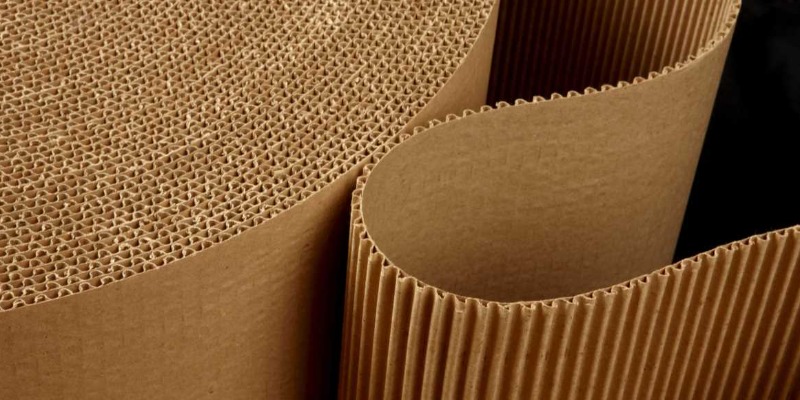 Compressed OCC cardboard bales stacked in warehouse